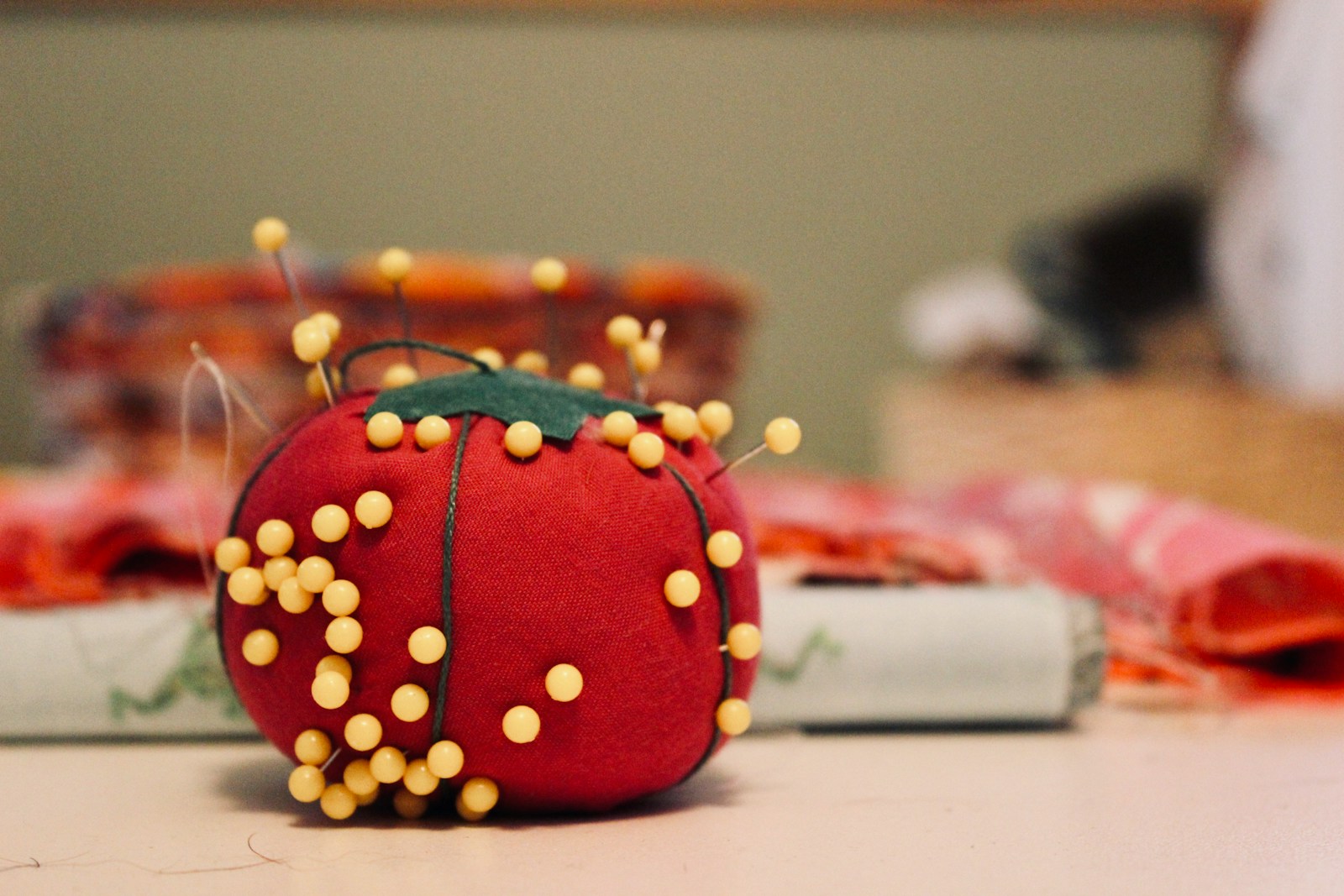 pin cushion on white surface