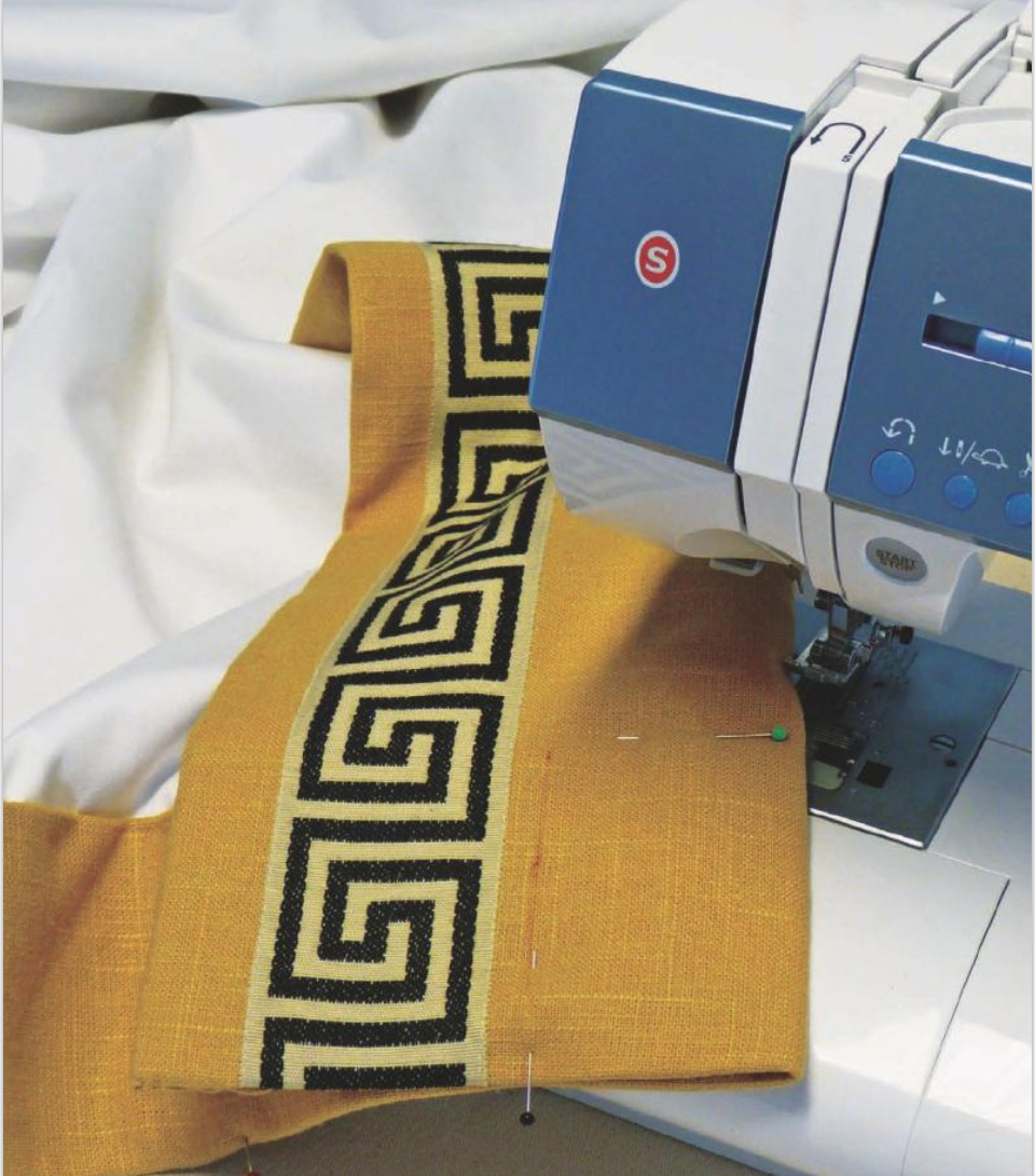 curtain fabric being sewn in sewing machine